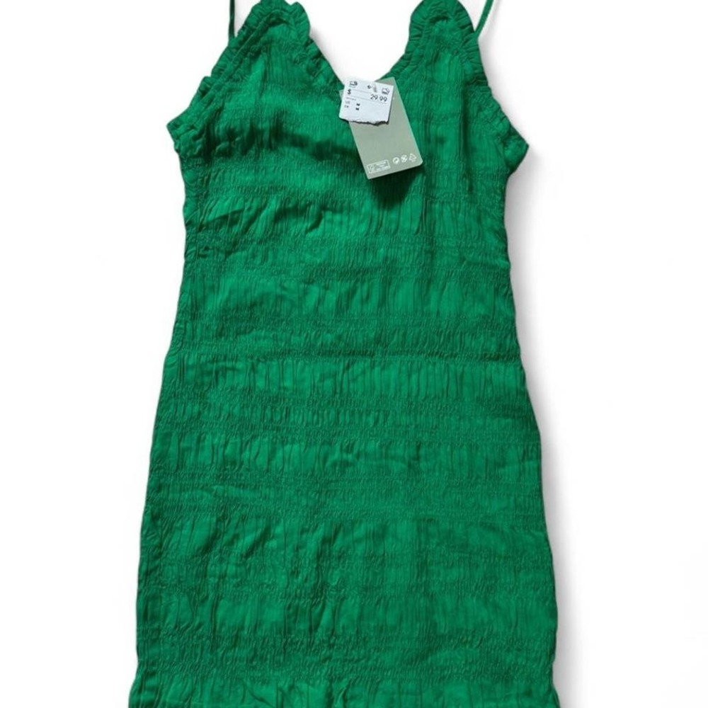 NWT H&M green mini dress with ruffle hem and adjustable straps. Size M